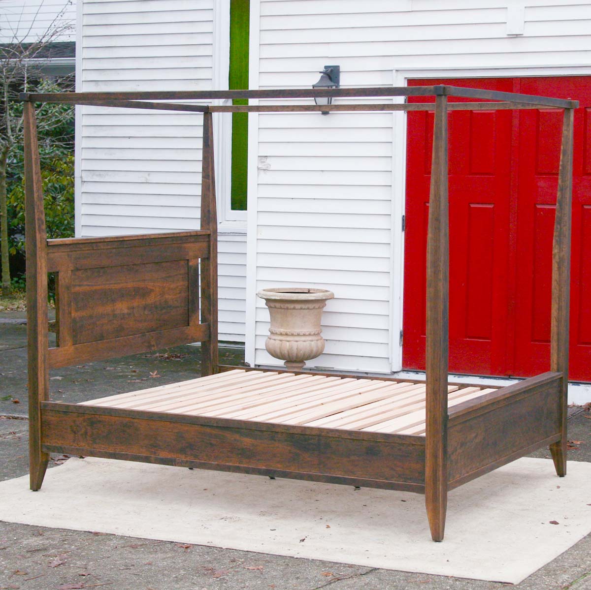 side angled view wood Canopy Bed with Shaped Headboard