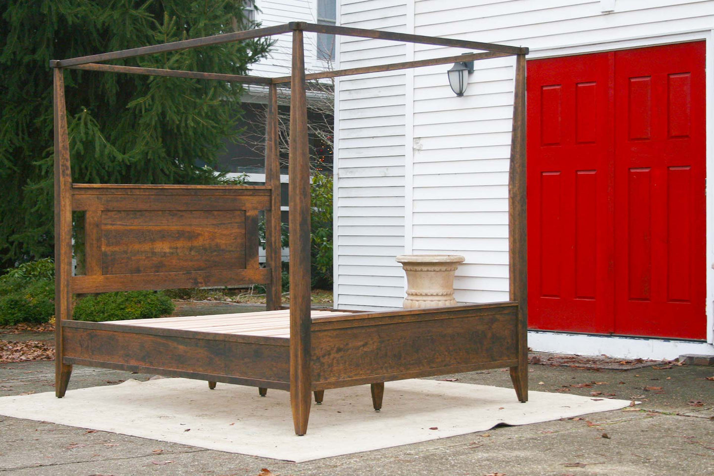 angled view wood Canopy Bed with Shaped Headboard