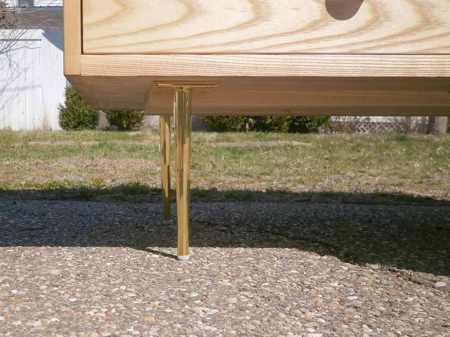 low view dresser with 8 inset drawers and mid century modern polished brass legs and drawer pulls