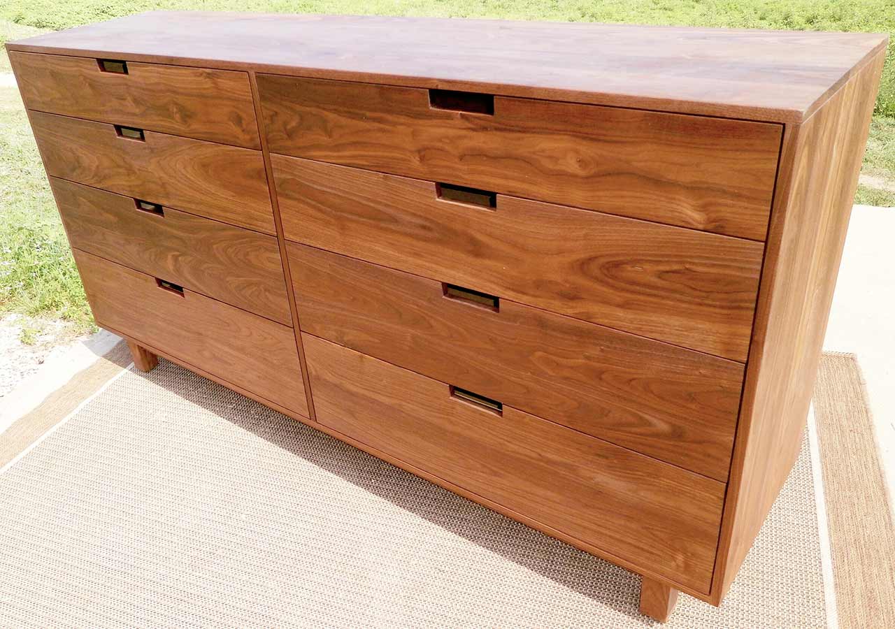 dresser with 8 inset drawers cut out drawer pulls and flat sides close up
