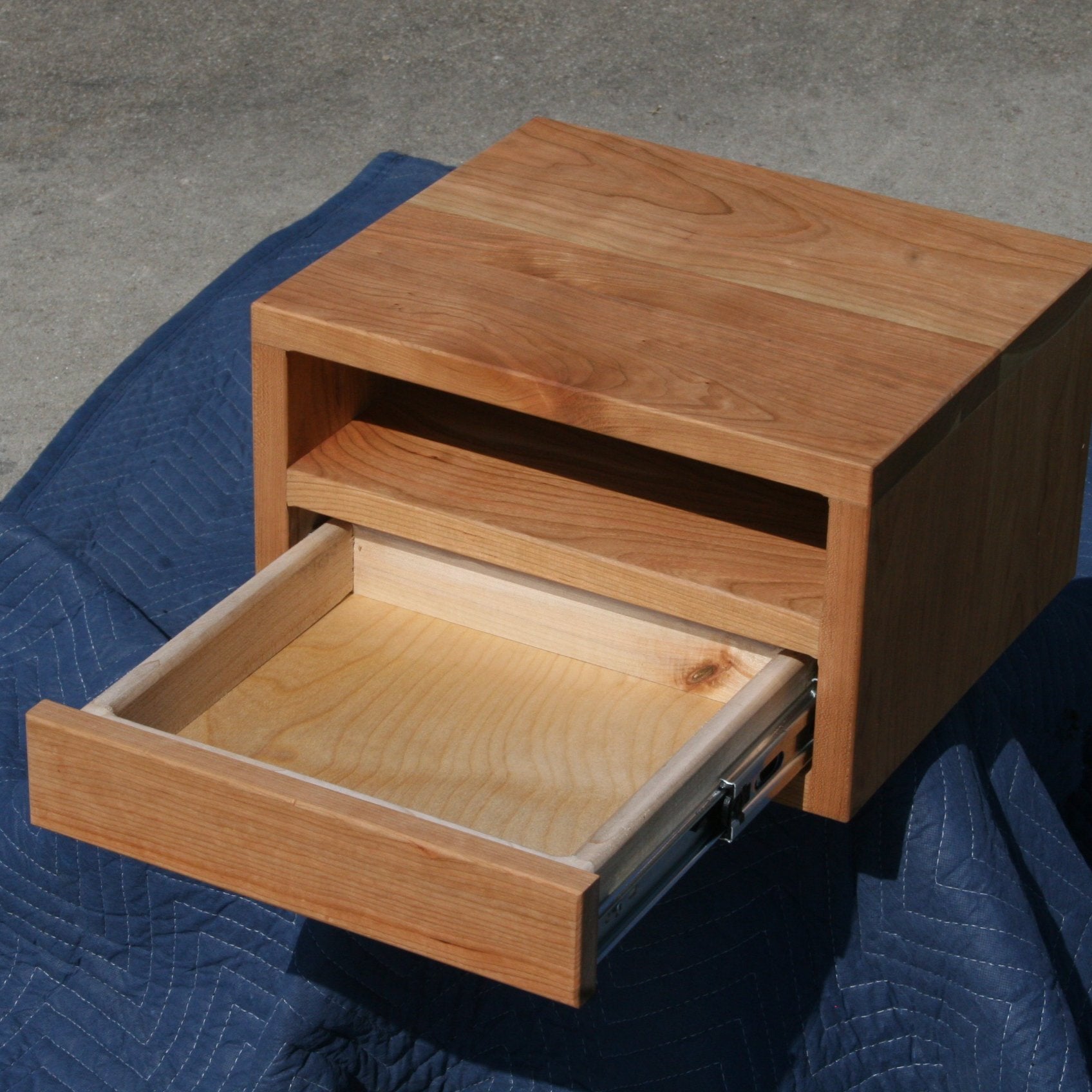 small bedside storage unit wood drawer open