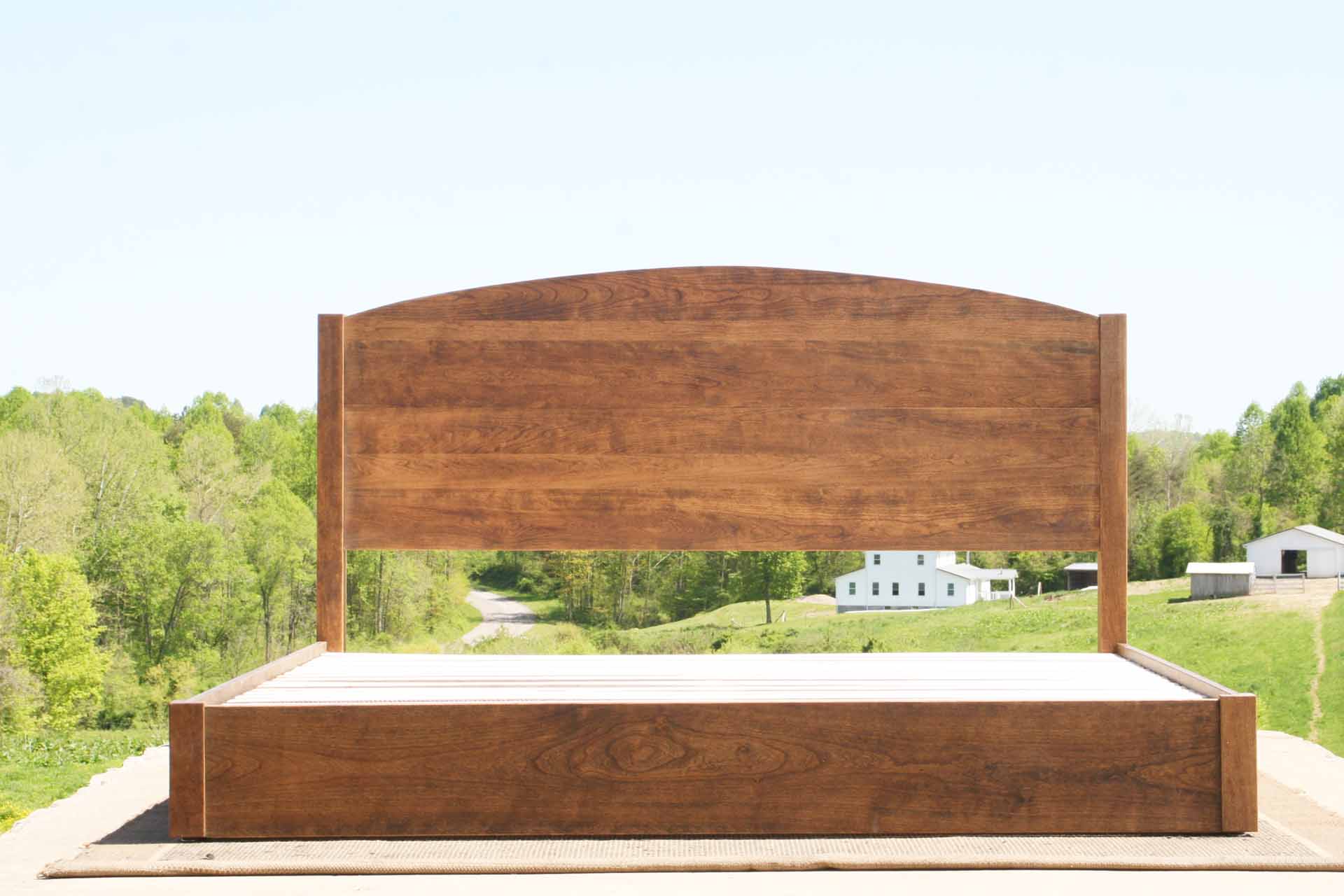 Low Platform Bed with arched headboard front view