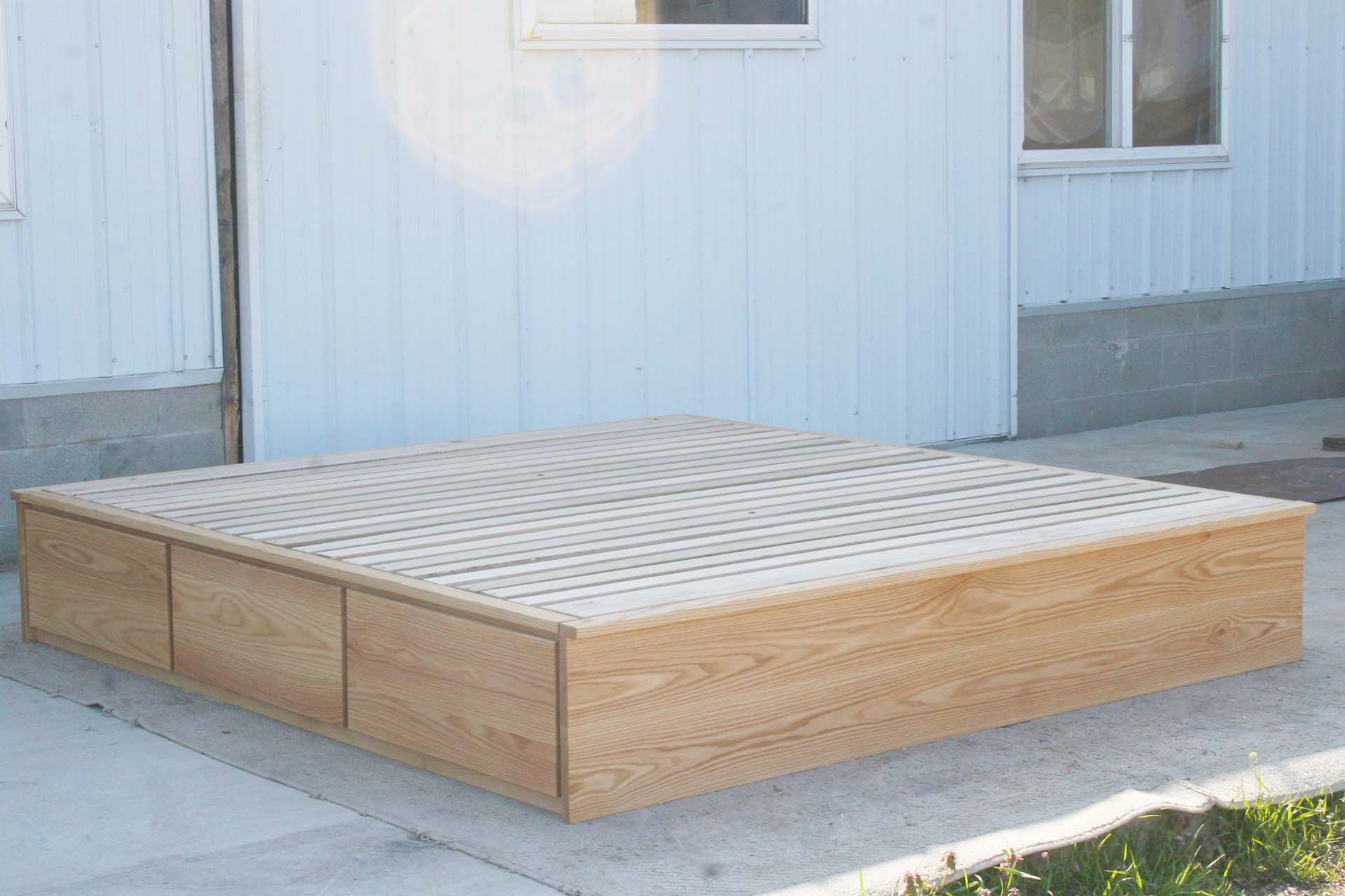 front angled view low storage bed with 6 drawers that has optional side tables