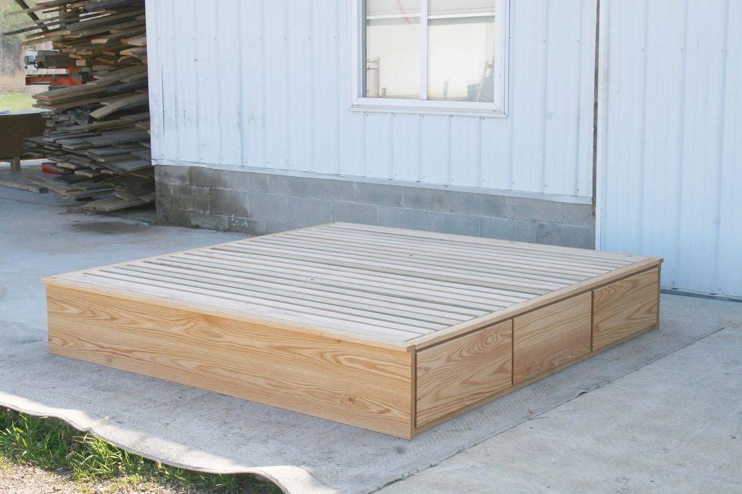 front angled view low storage bed with 6 drawers that has optional side tables