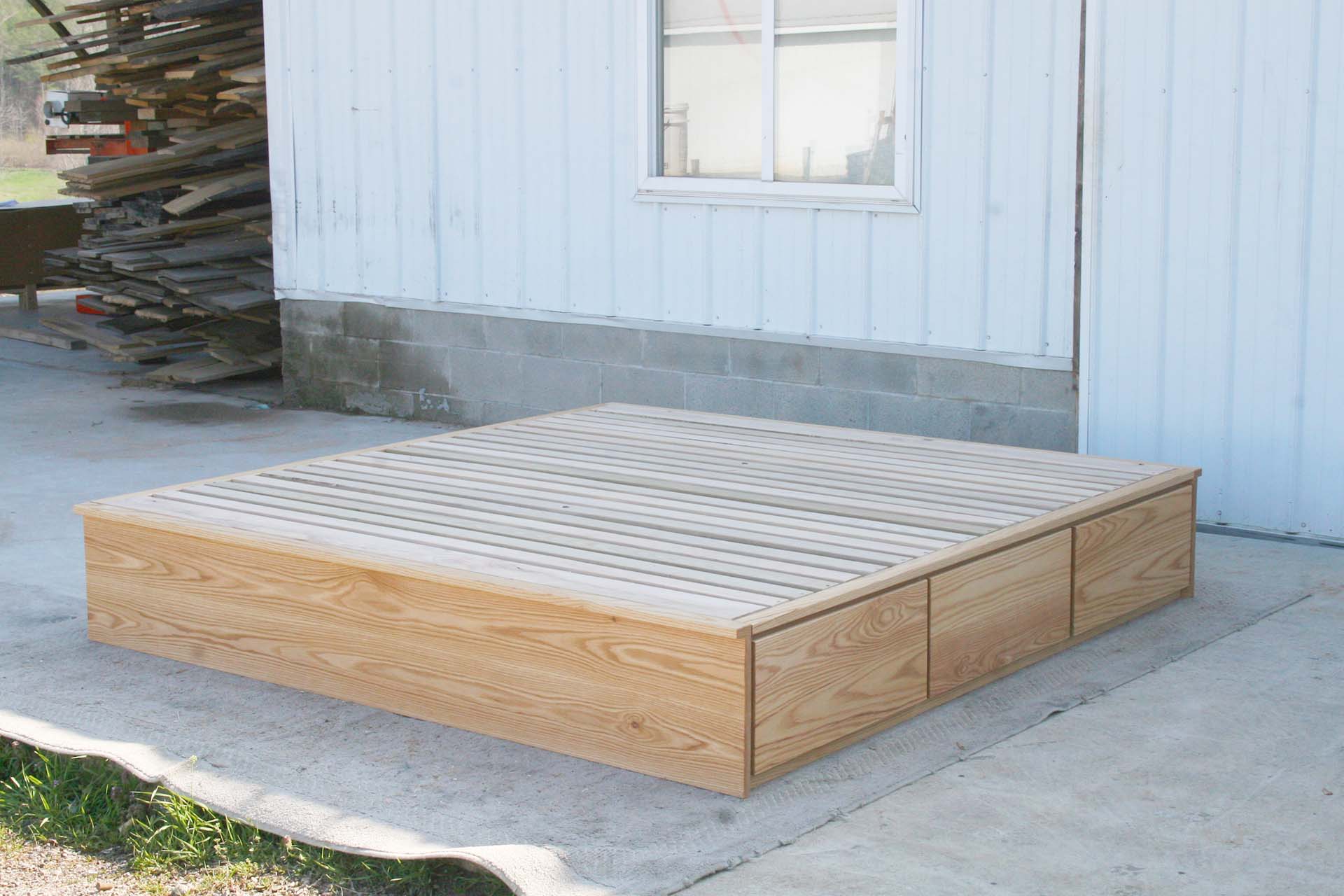 front angled view low storage bed with 6 drawers that has optional side tables