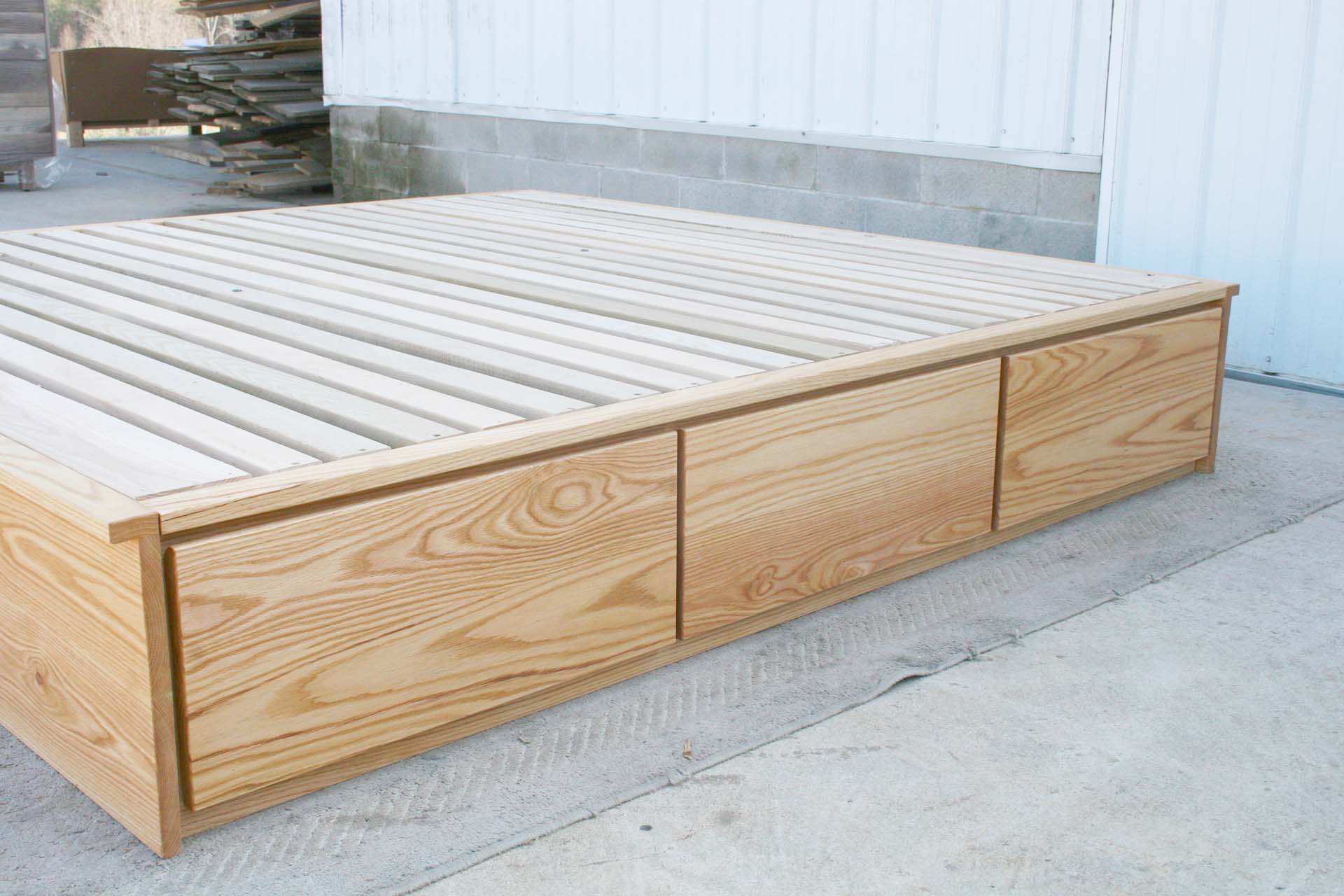 side of low storage bed with 6 drawers that has optional side tables