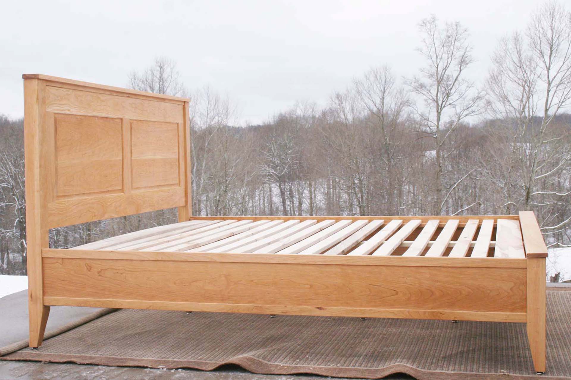 side view hardwood Platform Bed with paneled headboard and tapered post
