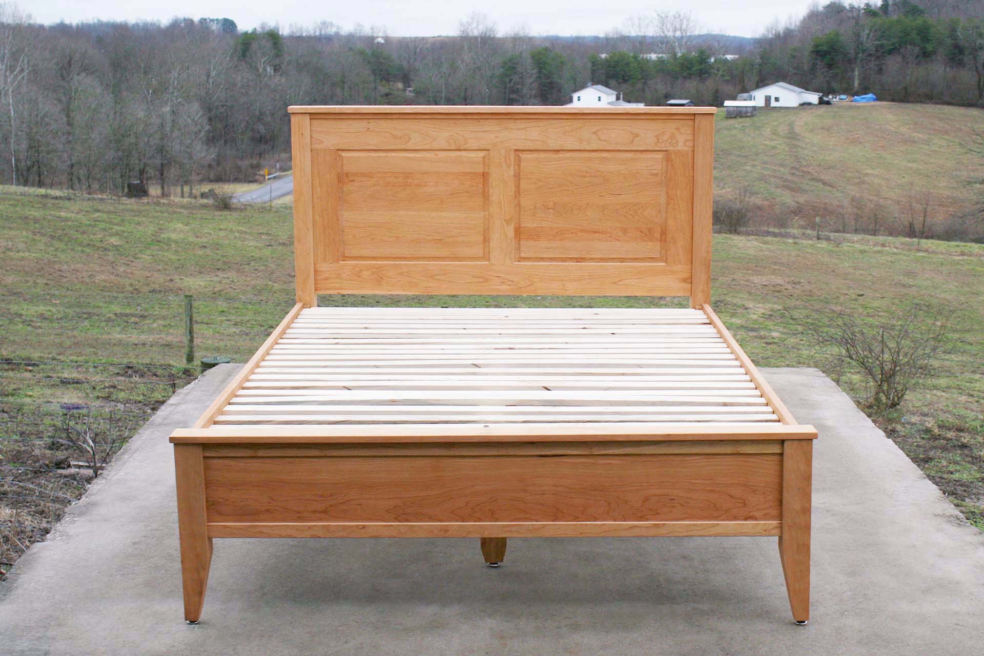 front view hardwood Platform Bed with paneled headboard and tapered post