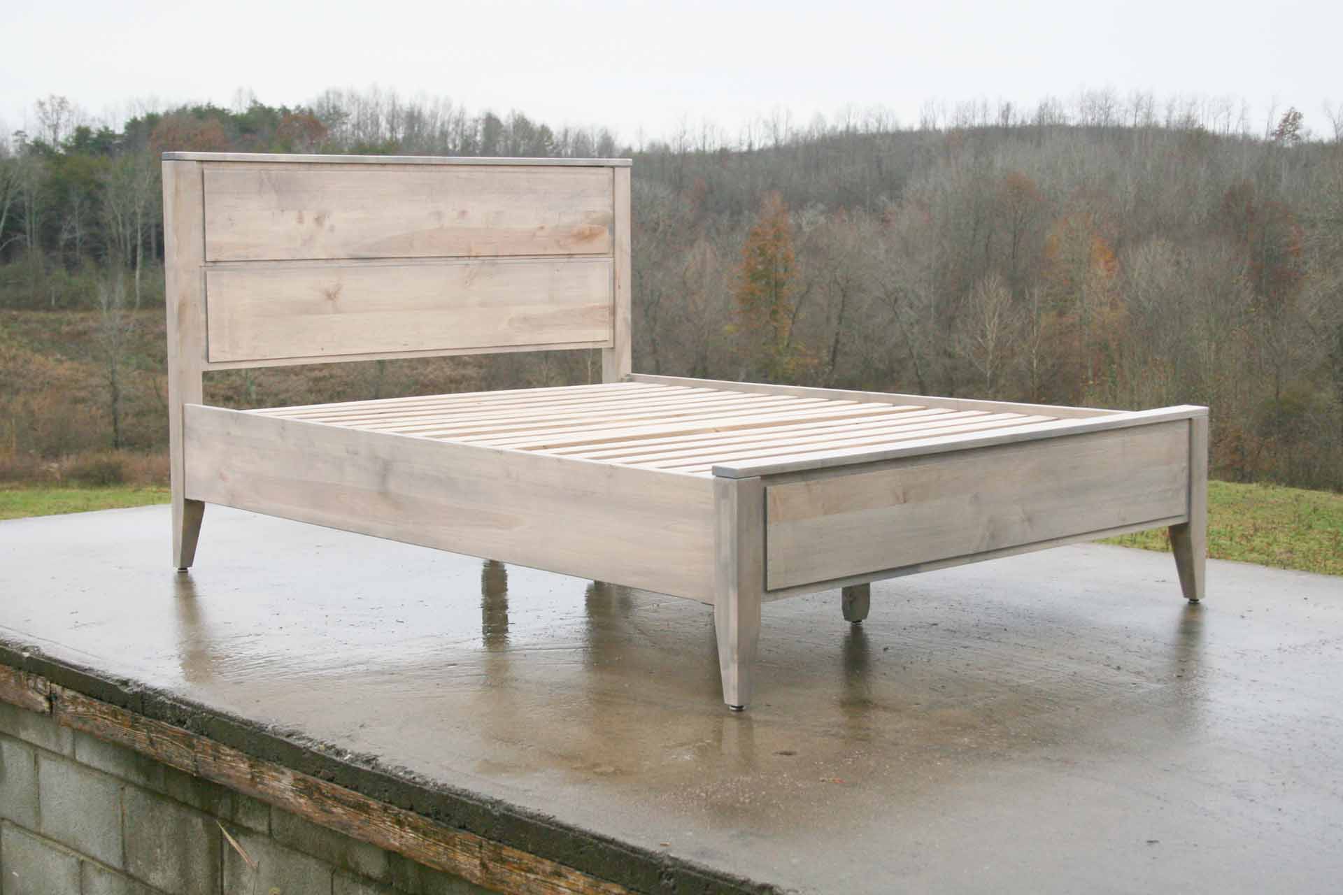 Paneled bed with platform and raised headboard white stained side view
