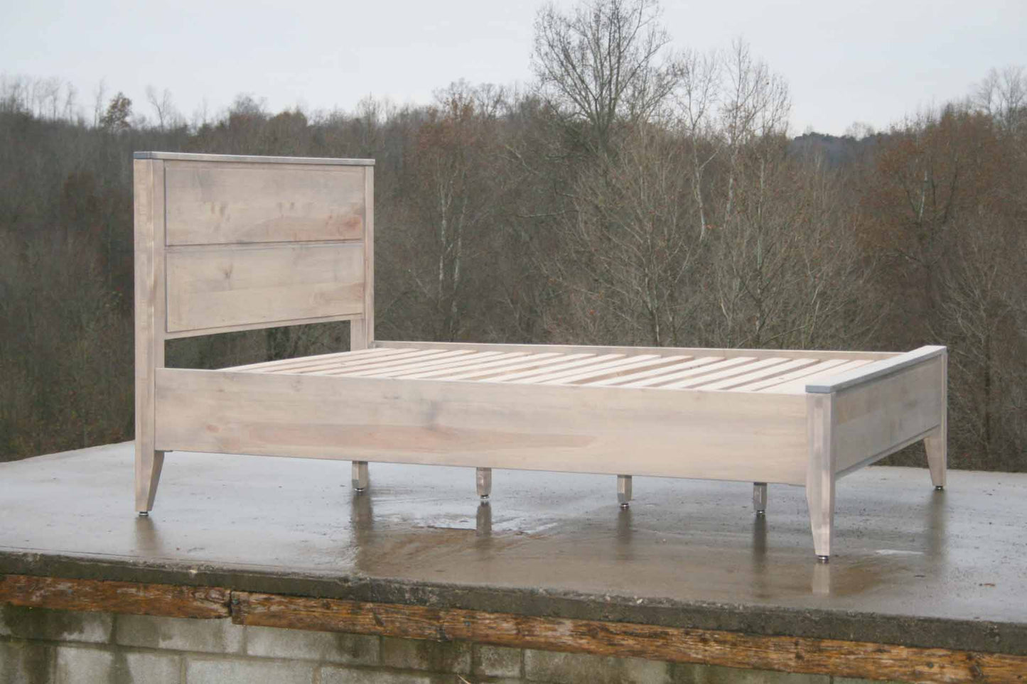 Paneled bed with platform and raised headboard white stained angled side view