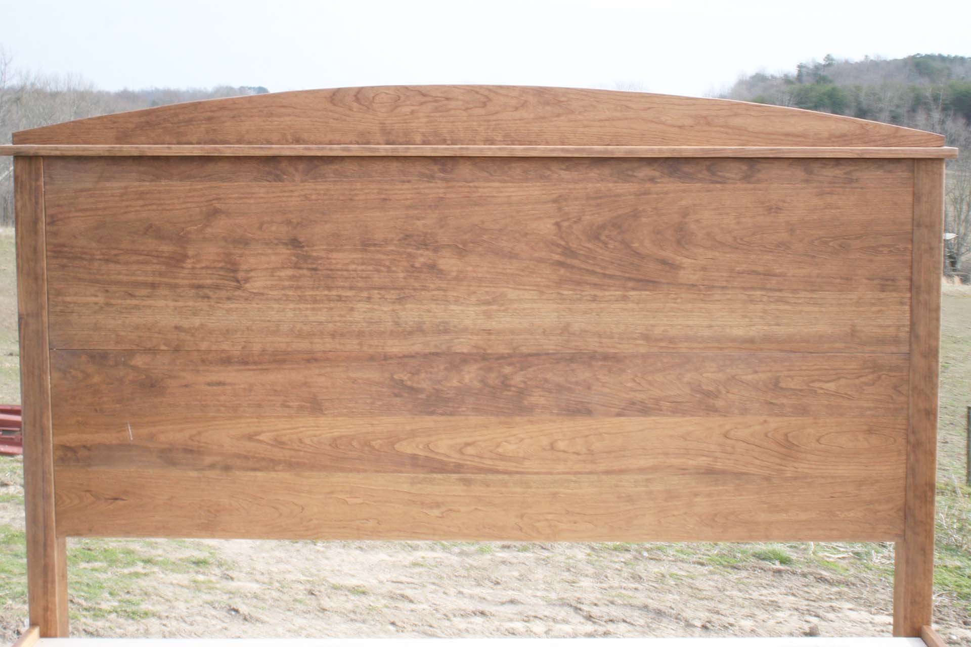 headboard of platform bed with tall arched headboard