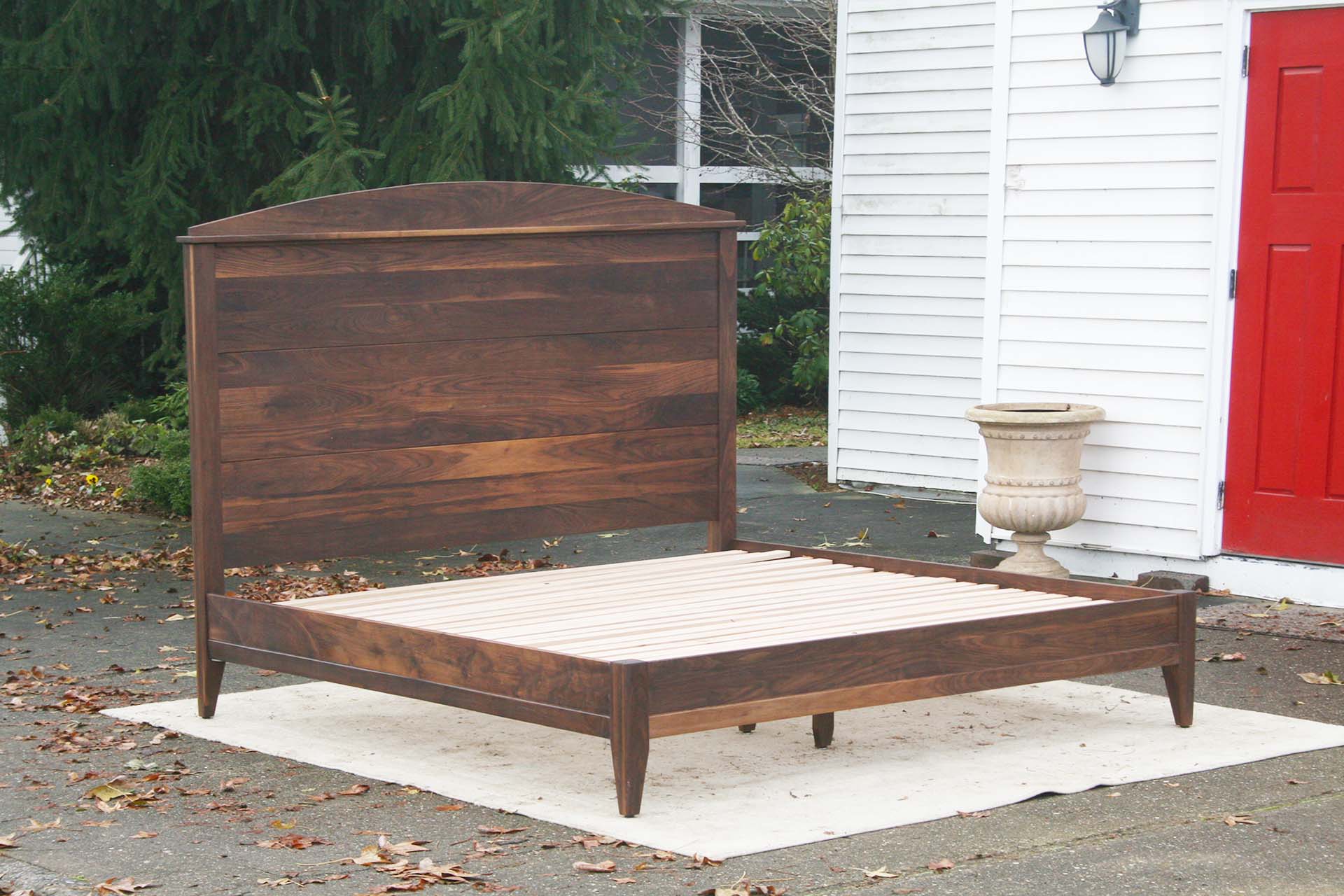 Platform bed with tall headboard side view