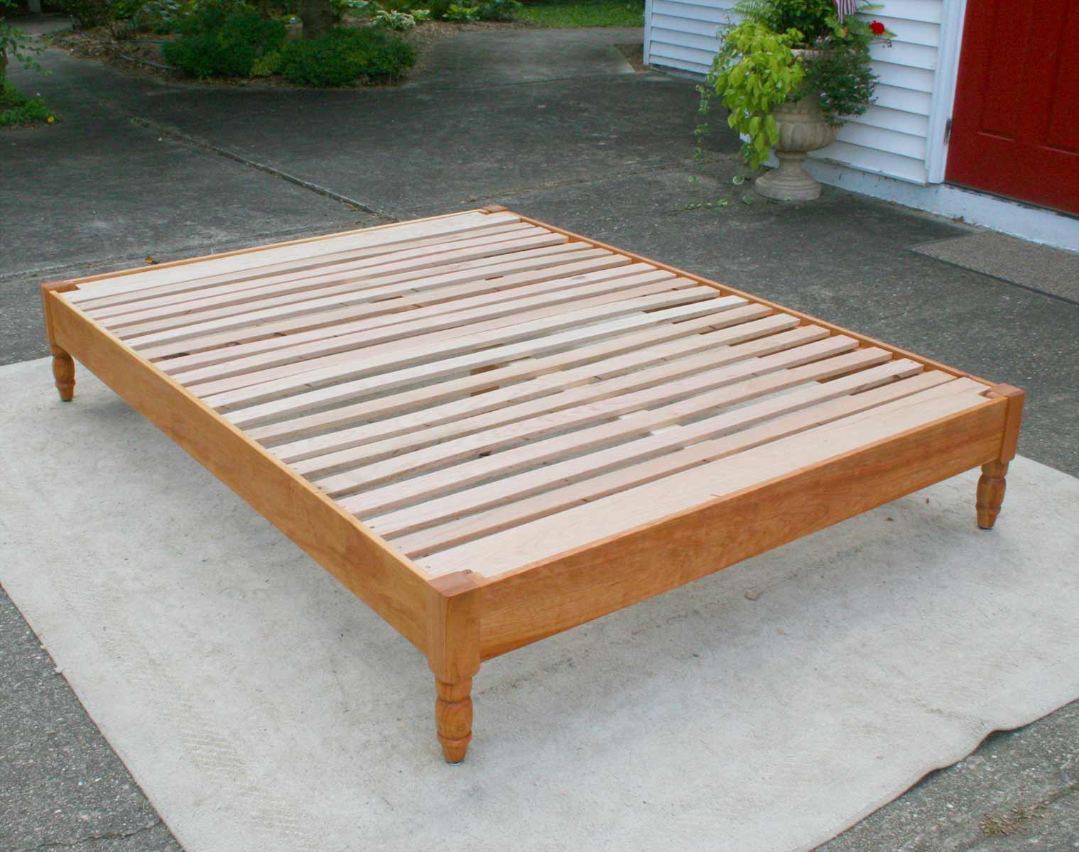 angled view platform bed with turned corner posts