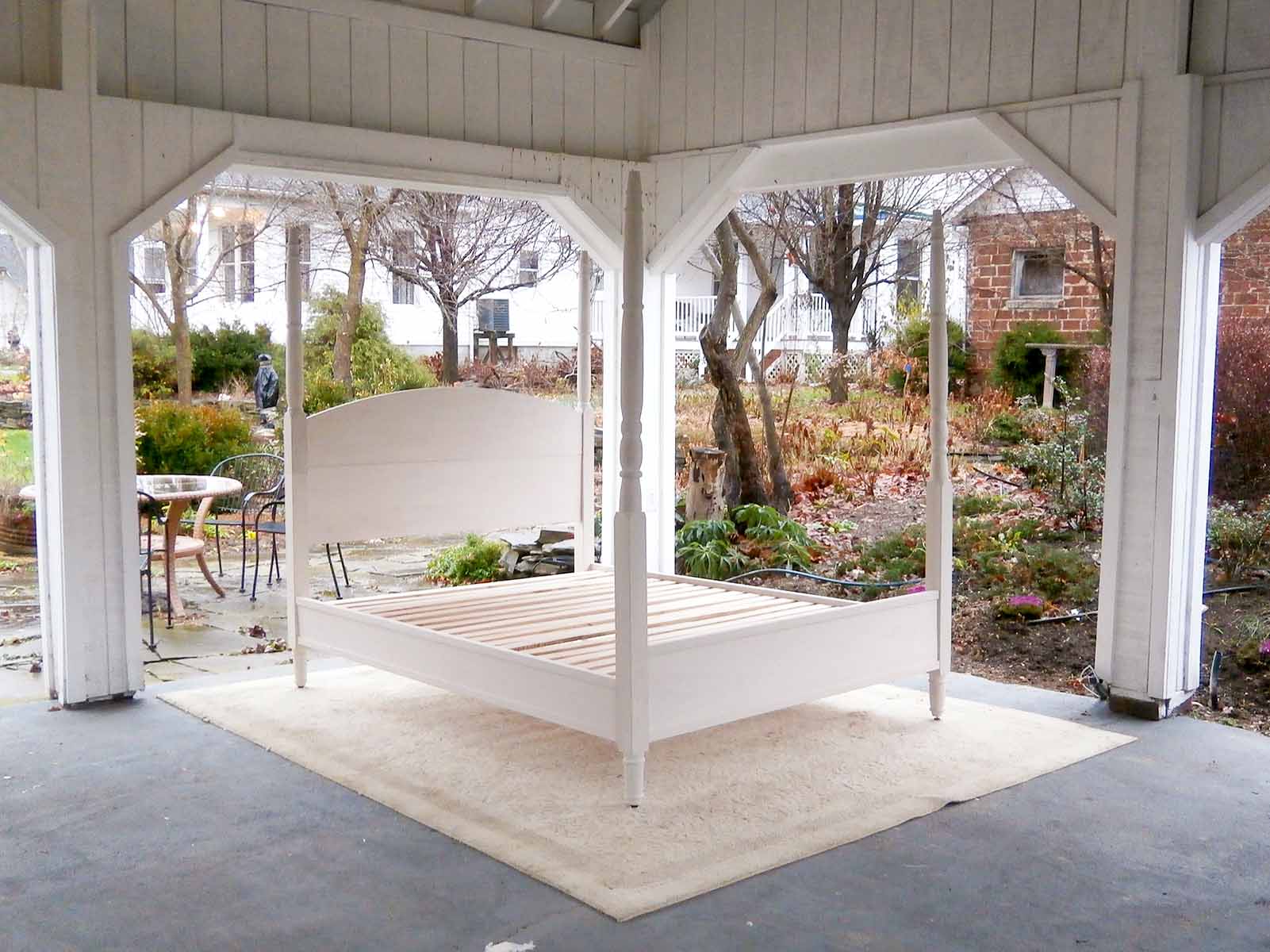 angled view turned post bed with arched head and footboards