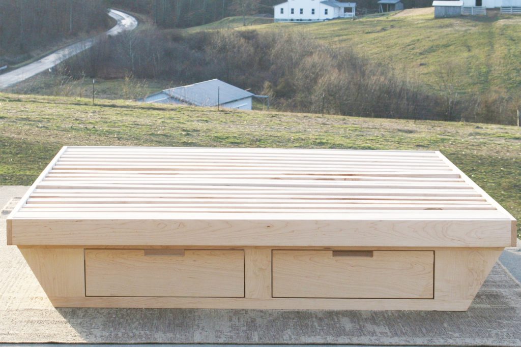 front view natural low Platform Bed with angled base and 2 drawers