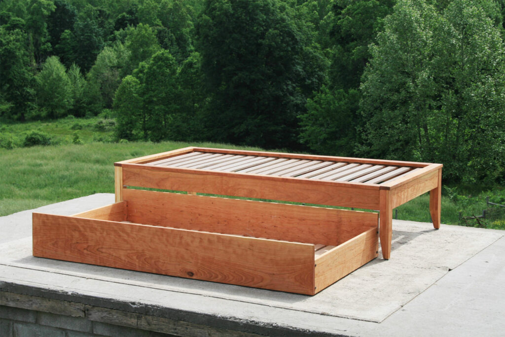 Trundle bed with platform top cap trim side view