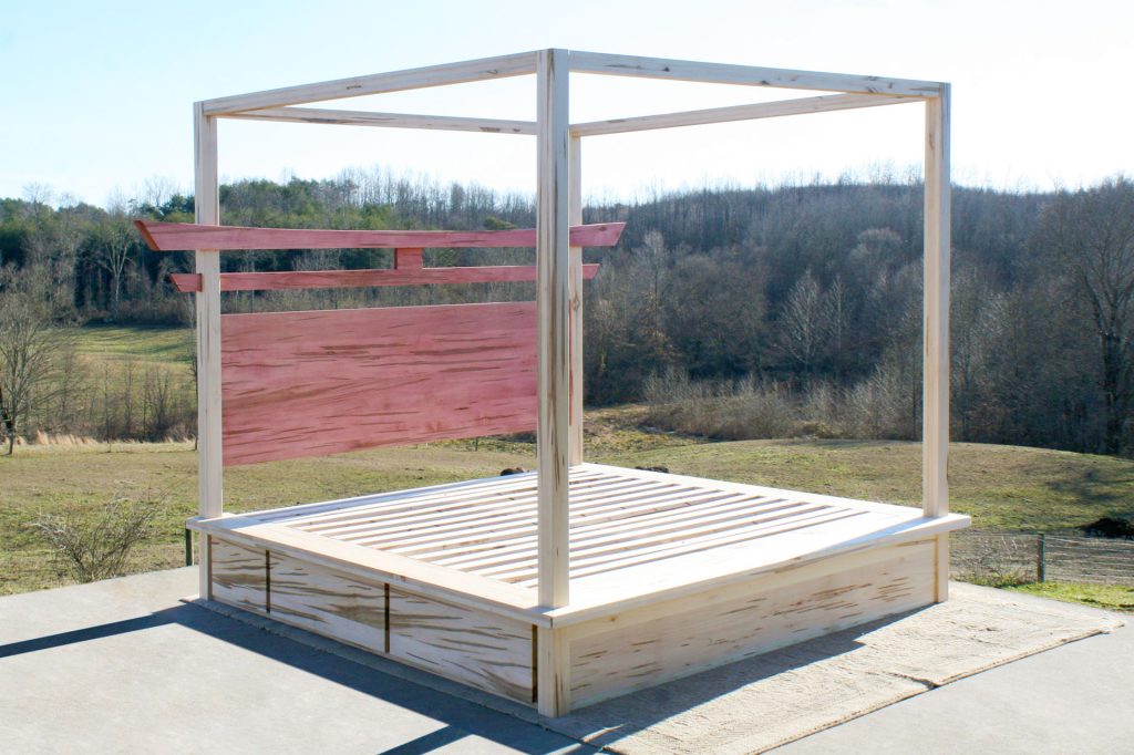 angled view Torii Gate bed with 6 drawers and square canopy