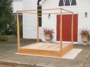 Platform Bed with a large rail canopy and tapered posts side view